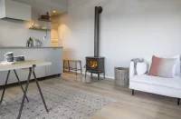 Litinová krbová kamna JOTUL F 100 ECO LL ČERNÝ LAK - v interiéru II Litinová krbová kamna JOTUL F 100 ECO LL ČERNÝ LAK - v interiéru II